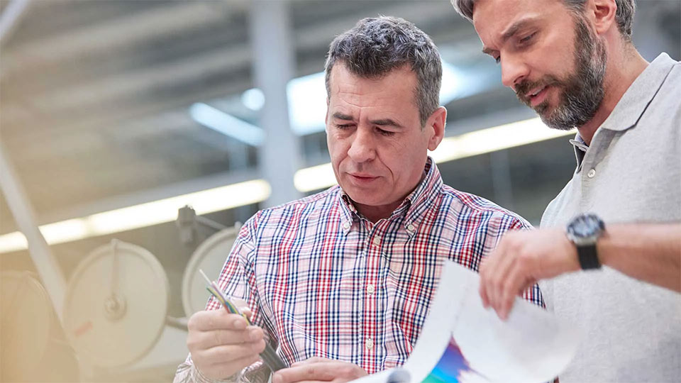 Two EHS professionals perform an audit.