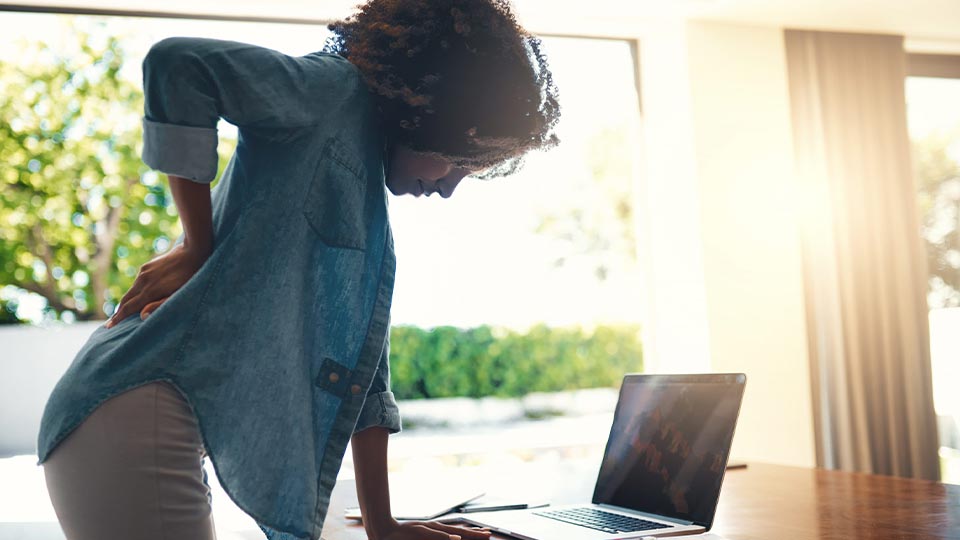 Female standing Infront of Office Desk