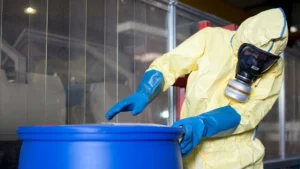 Worker Checking Waste Drum
