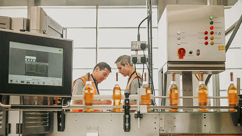 Bottling Factory Workers On Assembly Line