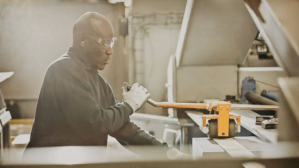 Employee operating heavy machinery