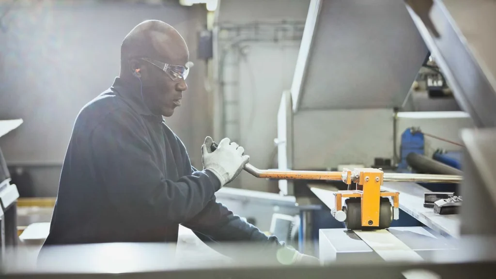 Employee operating heavy machinery
