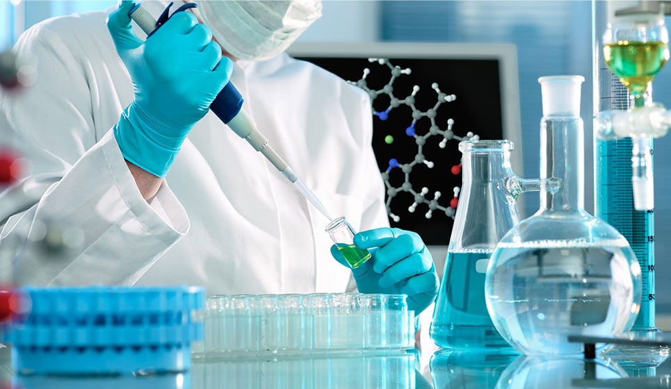 pharmaceutical professional handling hazardous drugs in vile