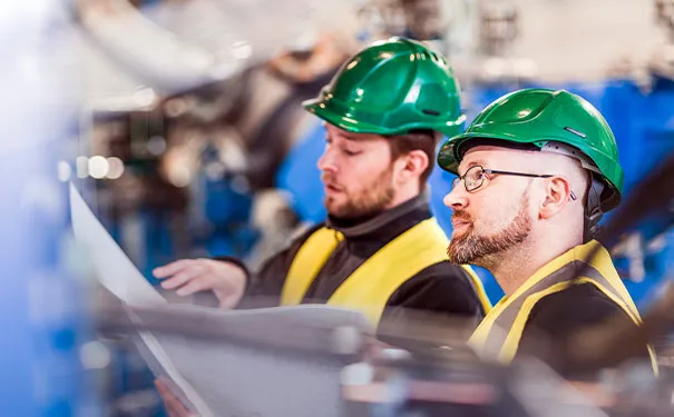 Safety professionals reviewing plans
