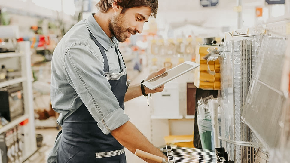 Retail worker looking at tablet