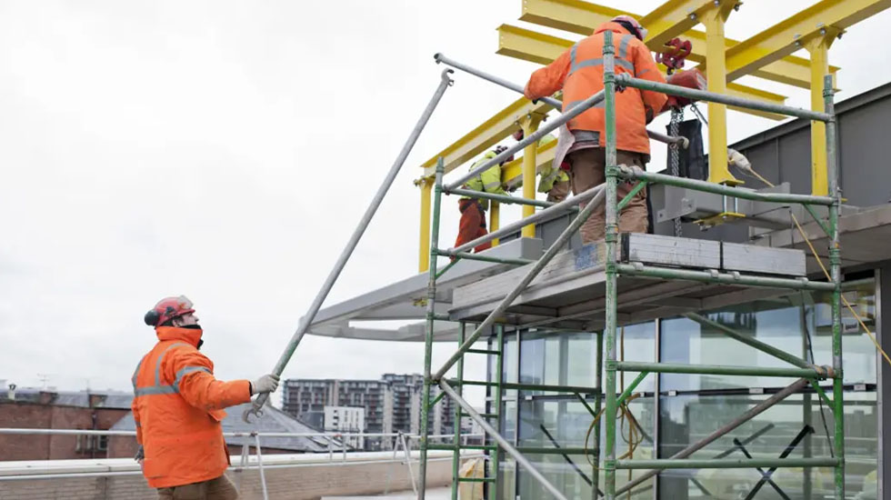 Two Workers On Scaffolding