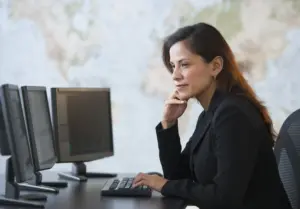 Woman looking at computer screens