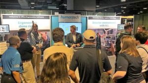 crowd of attendees at the AEC conference 2023 VelocityEHS ergonomics booth