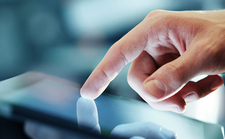 Finger Touching Tablet Screen