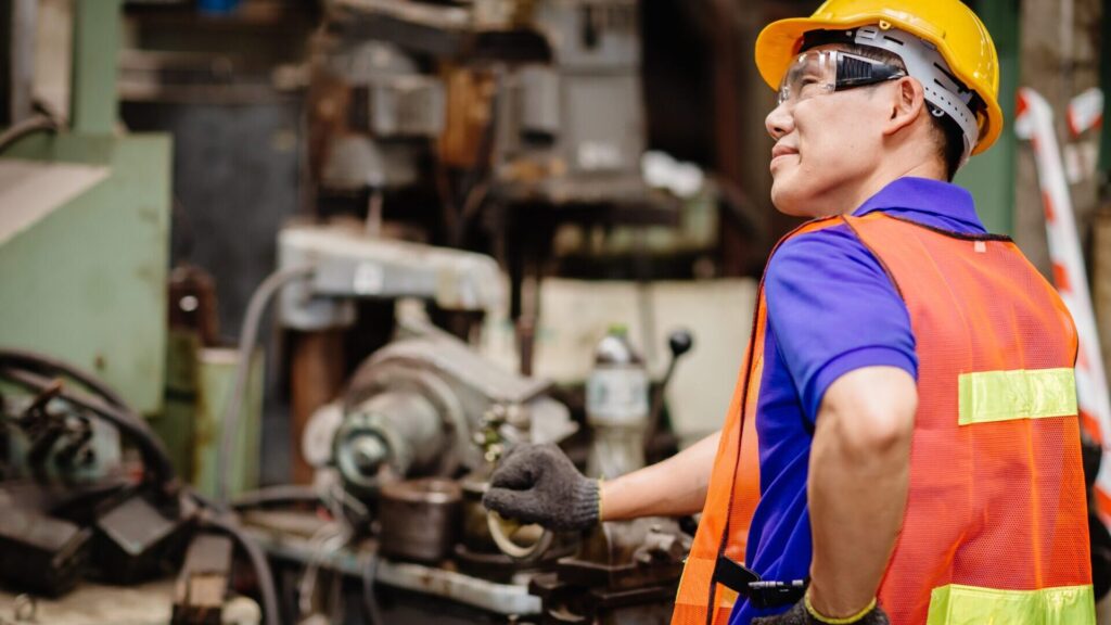 Confused Looking Worker With Back Pain