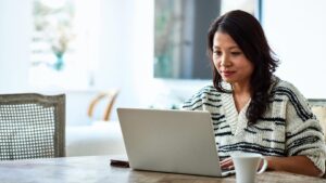 Woman working on laptop from home