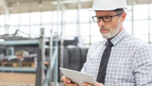 Engineer using digital tablet in factory