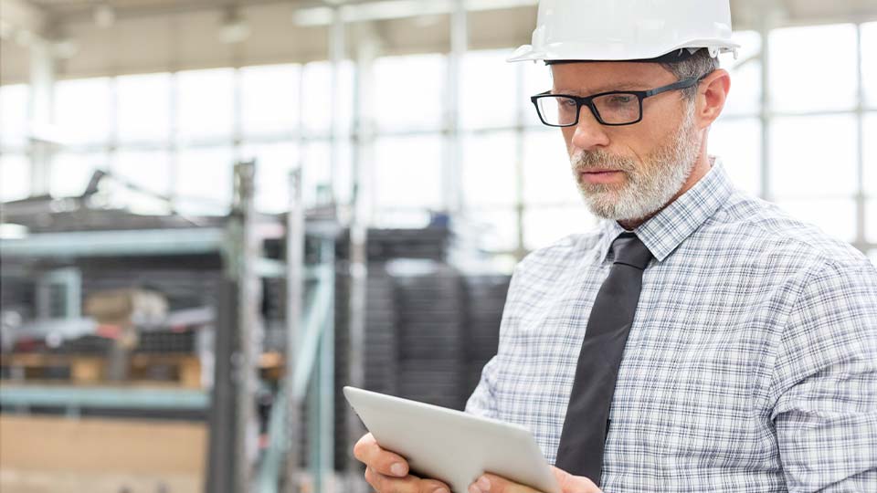 Engineer using digital tablet in factory