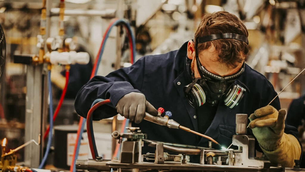 Man Pipe Welding wearing safety PPE