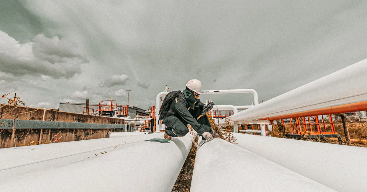Man On Pipes At Site 1200x628