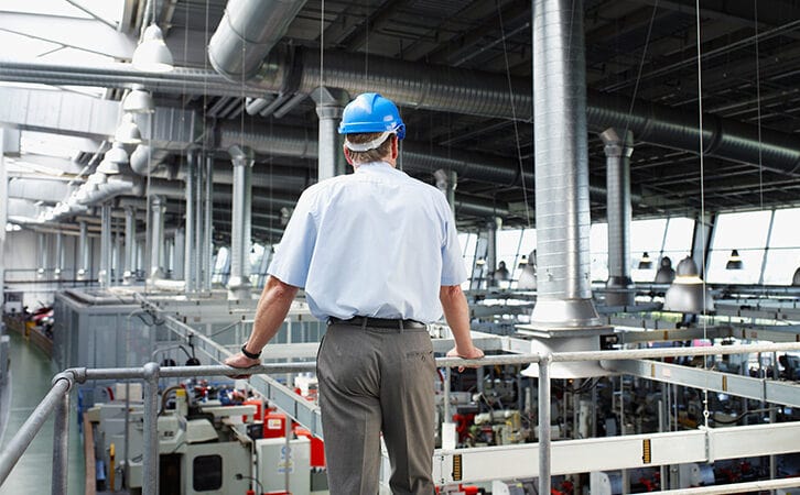Manager overlooking manufacturing operation