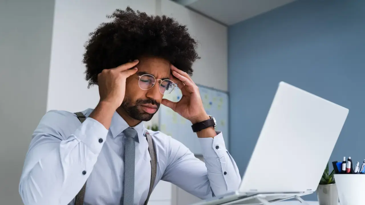 Man Frustrated in Front of Computer