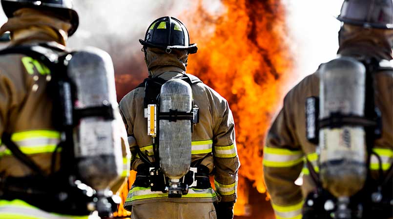Fire fighters looking at flames
