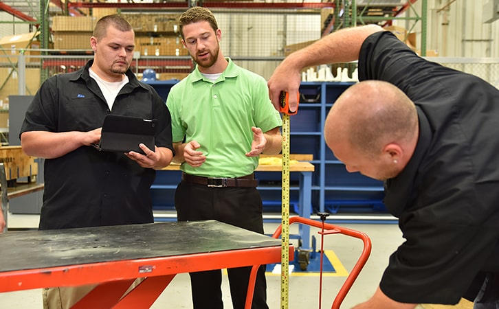 Staff inspecting facility equipment