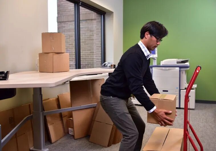 Employee lifting small box