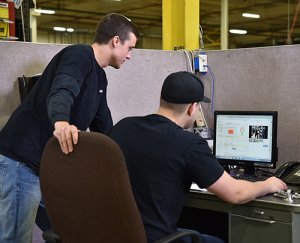 Plant employees at office desk