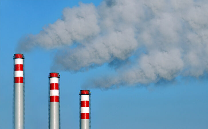 Factory Emitting Smoke in Air