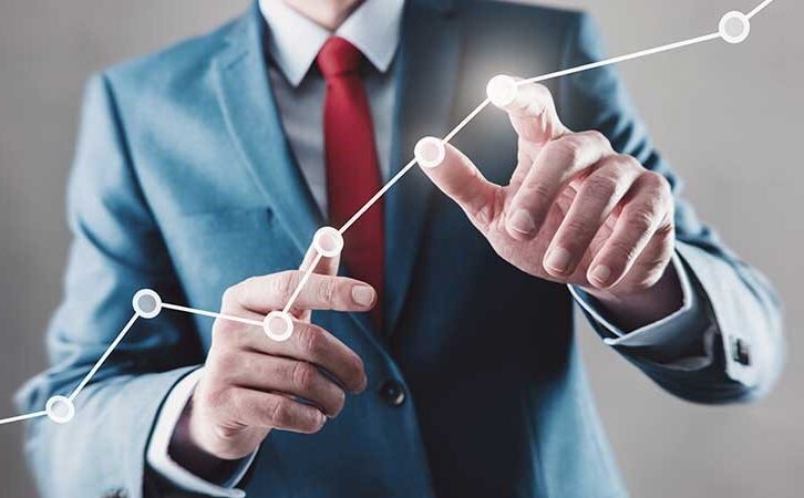 Man Touching Line Graph