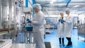 three pharmaceutical professionals in facility