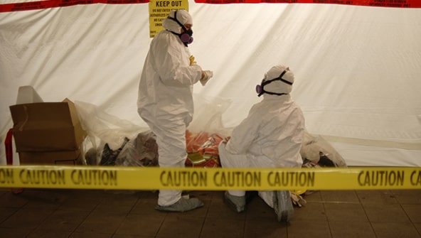 Professionals in regulated area with hazardous material