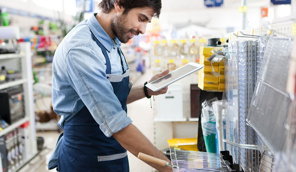 Retail worker looking at electronic EHS on tablet