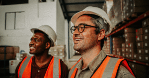 Men In Ppe In Warehouse