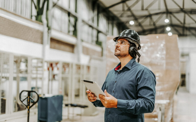 EHS worker using AI on floor