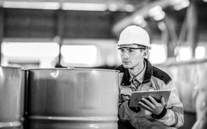 Male Engineer And Storage Tank At Manufacturing Factory