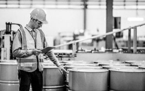 Male Engineer And Storage Tank At Manufacturing Factory