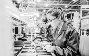 Ergonomics Worker Performing Repetitive Hand Assembly On A 1145276247 1200x750 Bw