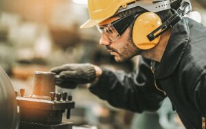 Industrial Engineers In Hard Hats.work At The Heavy Industry Manufacturing Factory.industrial Worker Indoors In Factory. Man Working In An Industrial Factory.safety First Concept.