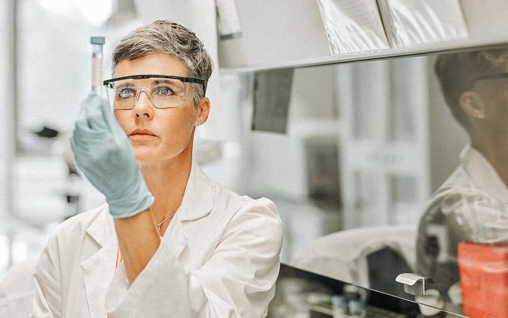 Female Researcher Examining Medical Sample In Lab
