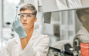 Female Researcher Examining Medical Sample In Lab