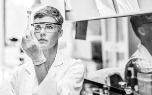 Female Researcher Examining Medical Sample In Lab