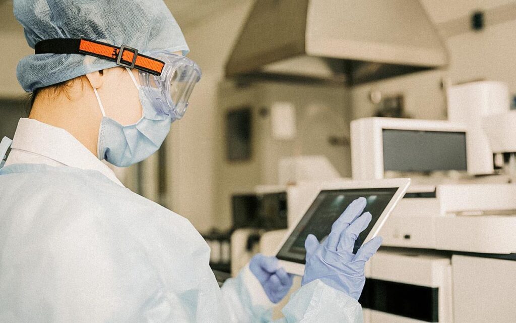 Young Female Scientist Working With Digital Tablet In Laboratory.