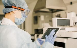 Young Female Scientist Working With Digital Tablet In Laboratory.