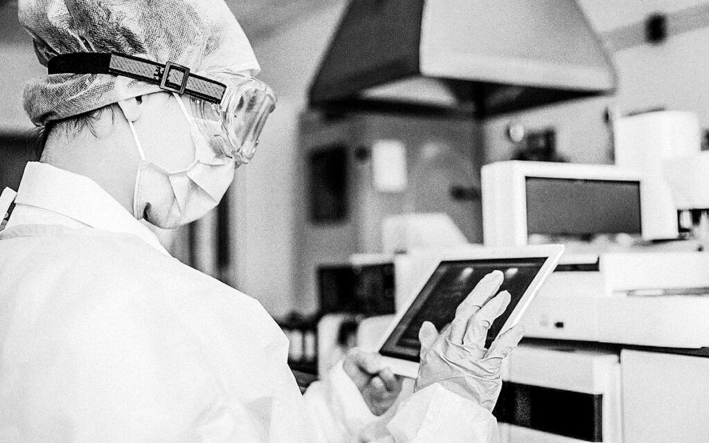 Young Female Scientist Working With Digital Tablet In Laboratory.
