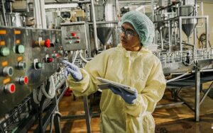Asian Female Mechanical Engineer Inspects Belt System In Food Production Factories, Export. Business Factory Worker