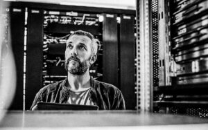 Male Technician Standing In Server Room