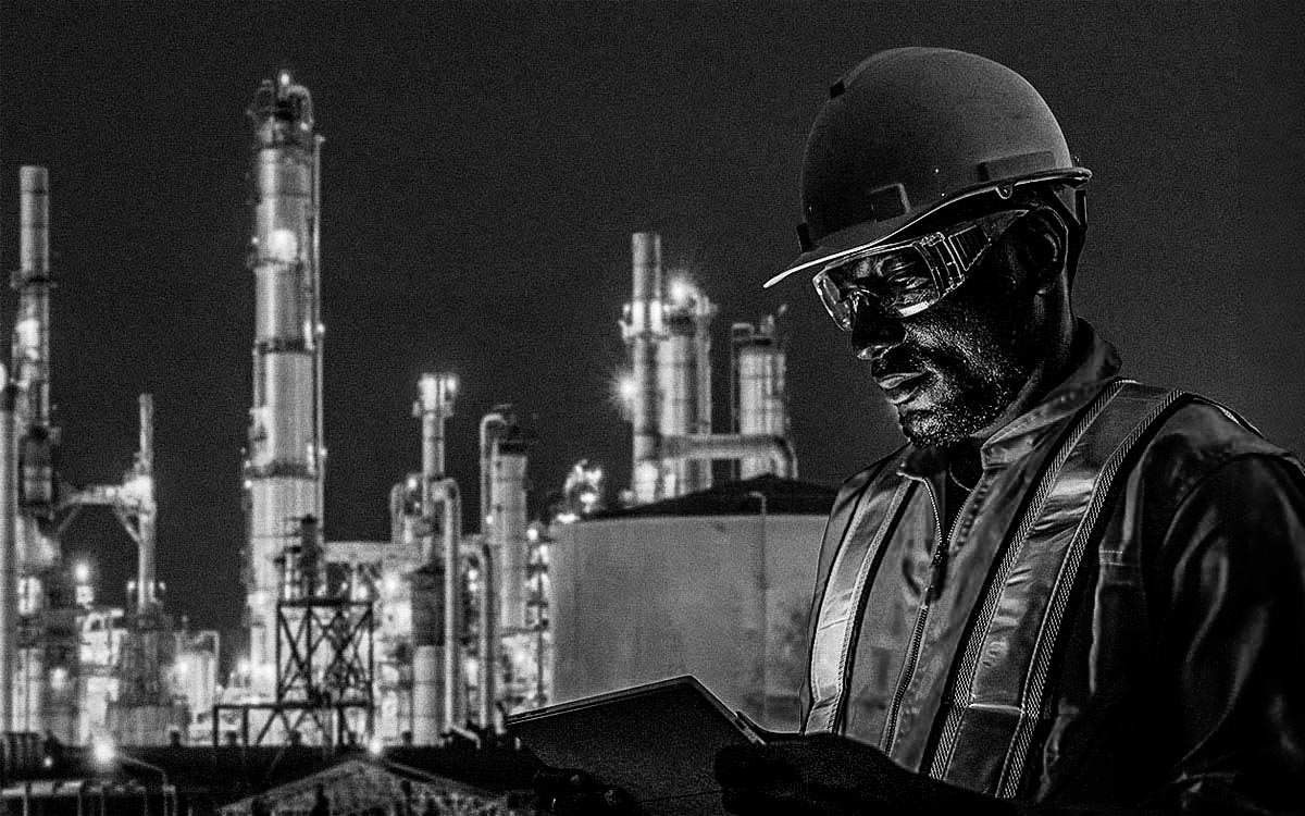 Engineer Using Tablet Near Oil Refinery Industry.