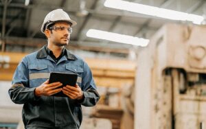 Portrait Of Professional Engineer Senior Staff Hand Control Checking Work Flow Of Machinery System In Factory Background With Tablet Laptop Technology Device
